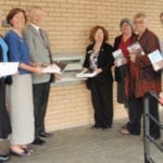 Directors of each participating local library join Secretary of State Sam Reed in launching the new One Card program.