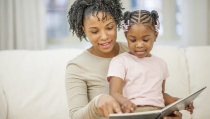 mother and child reading together