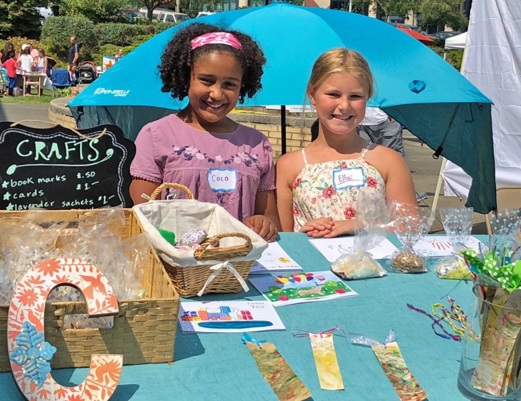 Two young craft fair vendors