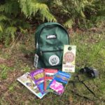 Backpack with Discover Pass, field guides and binoculars